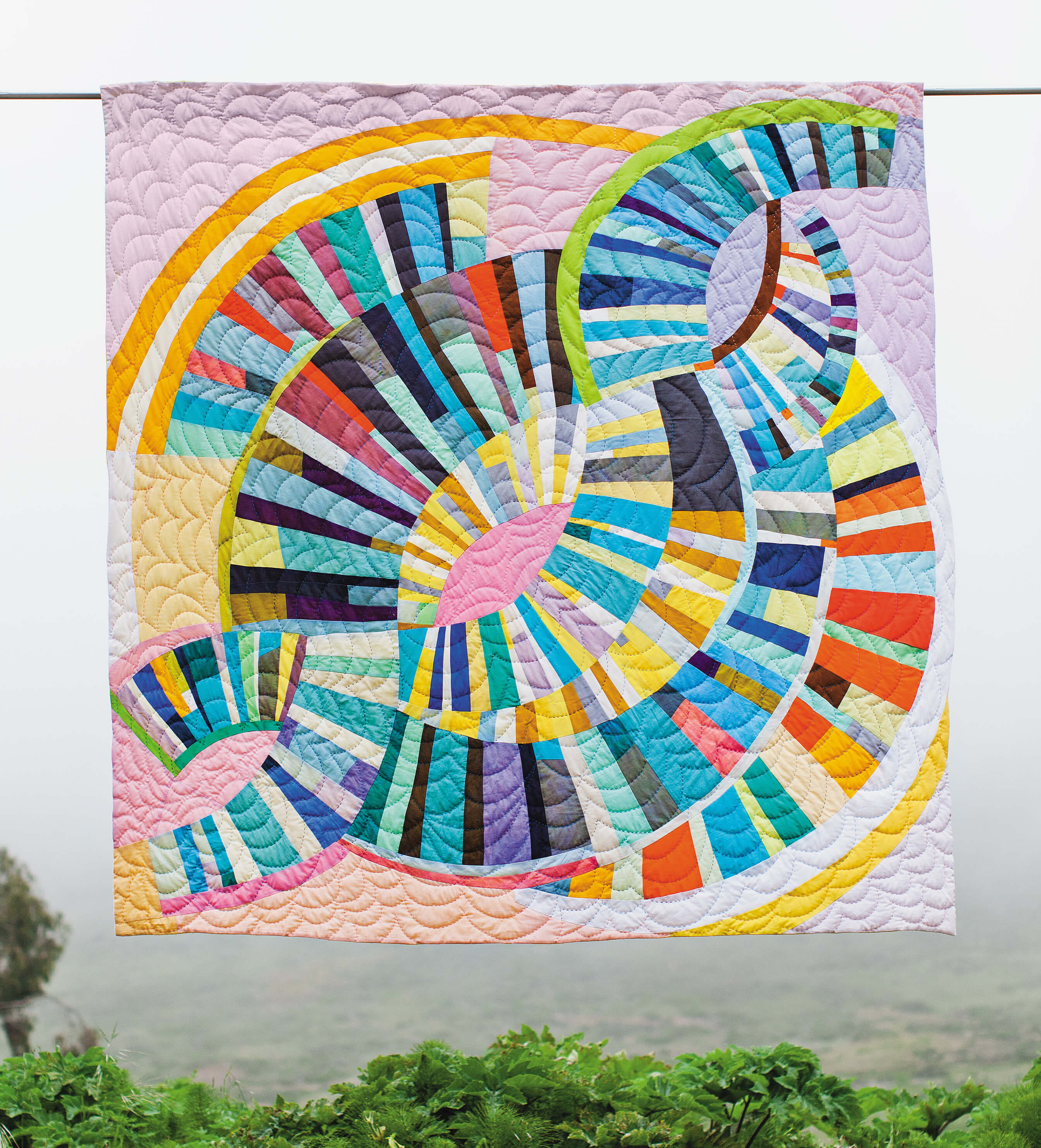 Quilt design by workshop tutor Sherri Lynn Woods - circular pastel shades.