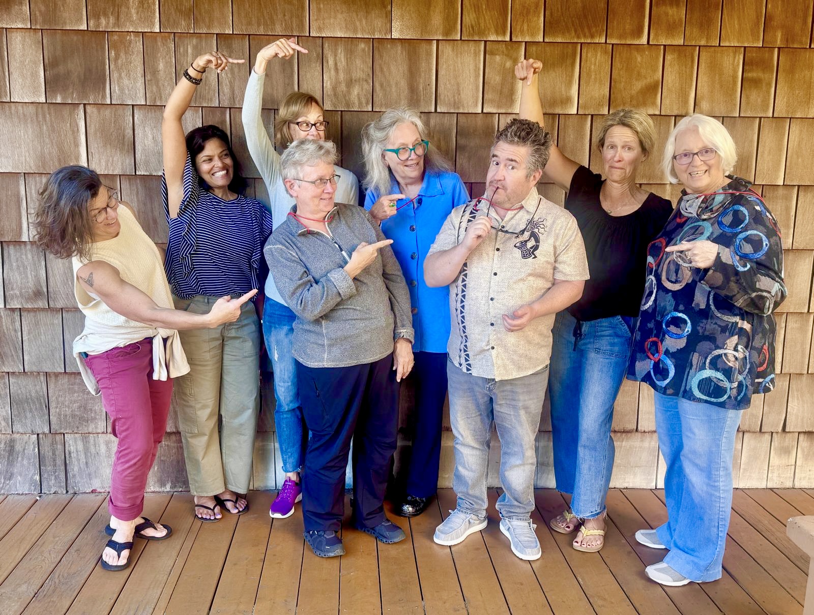 Group of students with workshop tutor and writer John Roedel.