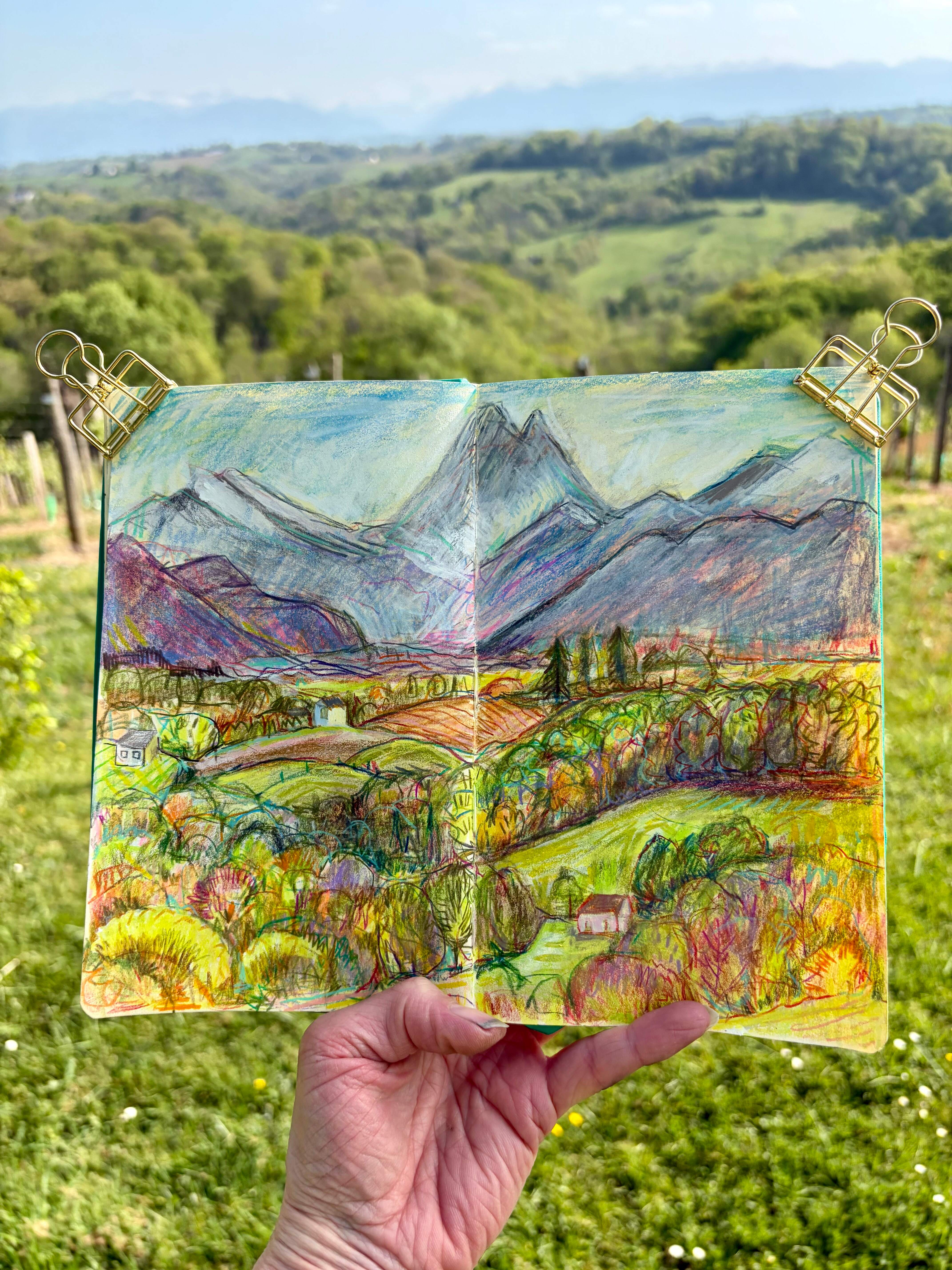 Colourful sketch of view of fields and mountains from Clos Mirabel by drawing workshop tutor Sam Marshall.