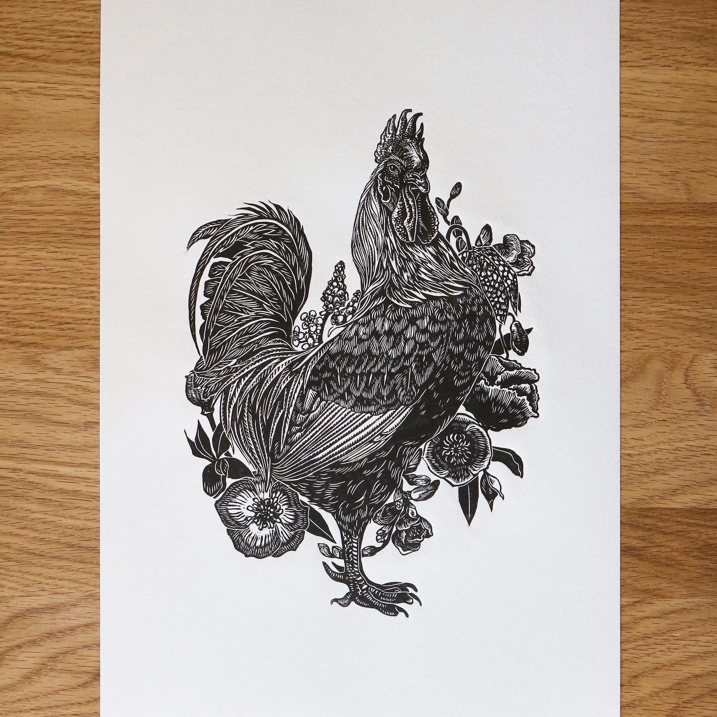 Black on white print of a rooster by artist and tutor Emily Robertson.
