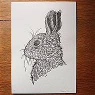 Lino print of a rabbit, black on white by Lino print artist and tutor Emily Robertson.