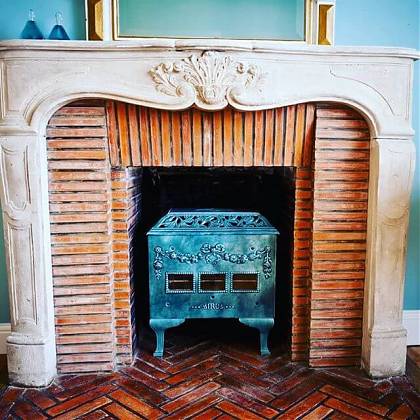 Fireplace with blue wood burner.