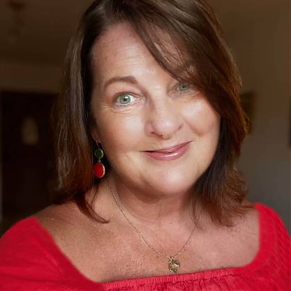 Botanical art tutor and artist Mary Dillion wearing red top.