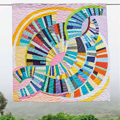 Quilt design by workshop tutor Sherri Lynn Woods - circular pastel shades.