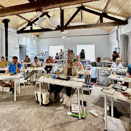 Group painting at desks in Atelier at Clos Mirabel.