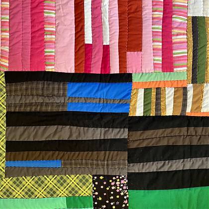 Quilt by quilter and workshop tutor Sherri Lynn Wood pink and brown strips.