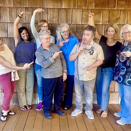 Group of students with workshop tutor and writer John Roedel.