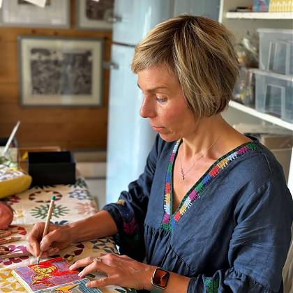 Sam Marshall at her desk - drawing into printing - linocut workshop Atelier Clos Mirabel.