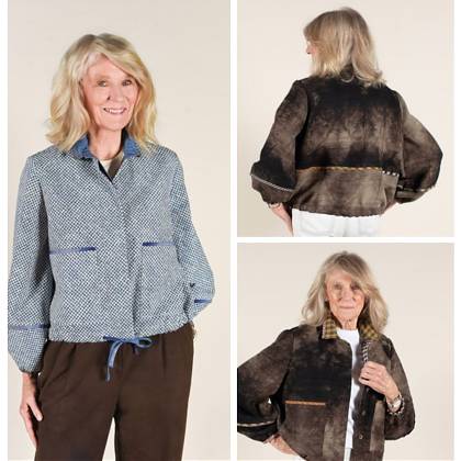 Woman modelling a blue and brown jacket.