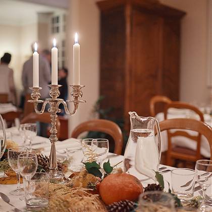 Autumn table set up for a large group with candles