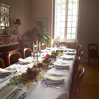 Table set for a formal dinner with candles at Clos Mirabel. 