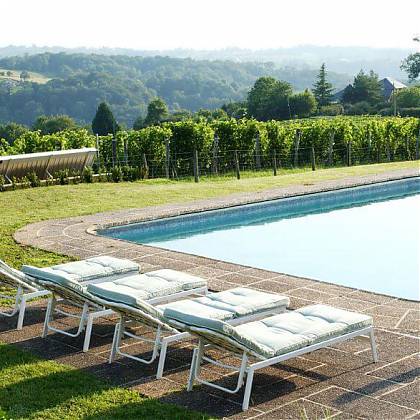 Pool with four sun loungers and clos mirabel vineyard views.