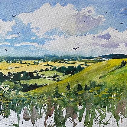 A watercolour countywide landscape in green with blue sky by painting holiday tutor Anthony Barrow.