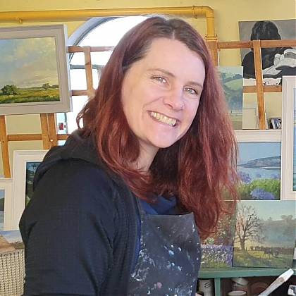 Photo of Jenny Aitken ARSMA with her painting in background.