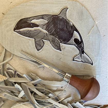 Detail of a lino cut design of a whale by tutor Emily Robertson.