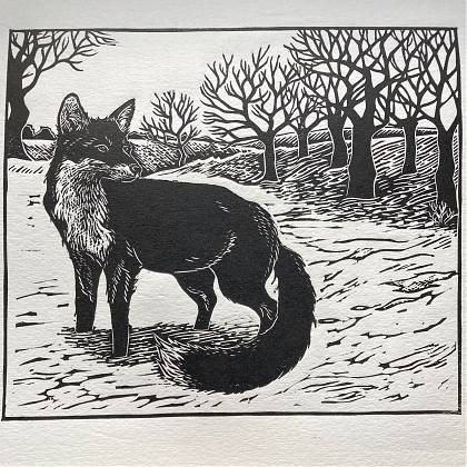 Black on white lino-cut print of a fox and trees.