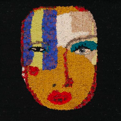Hooked rug design of a face by artist and workshop tutor, Graham Hollick.
